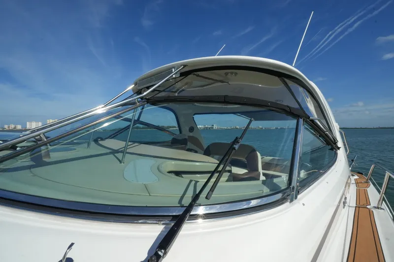 Slide: The Image of 2001 Sea Ray 510 Sundancer yacht on open water, clear sky background. - 32