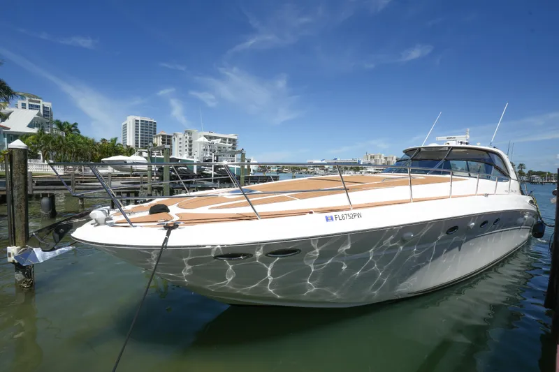 Slide: The Image of 2001 Sea Ray 510 Sundancer yacht docked in sunny marina. - 4