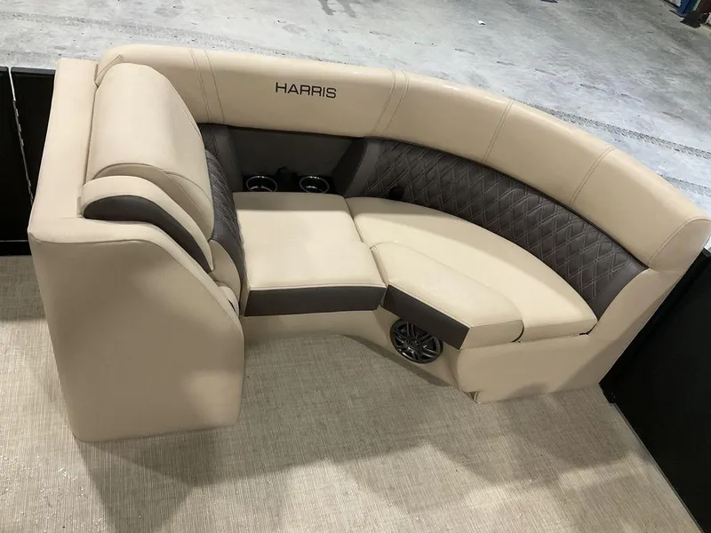 Slide: The Image of 2025 Harris Sunliner 230 Sport SLDH boat seating, beige and gray upholstery. - 2