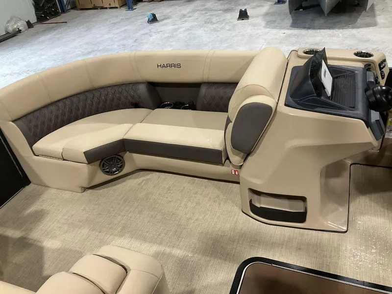 Slide: The Image of 2025 Harris Sunliner 230 Sport SLDH interior with beige seating and modern dashboard. - 8