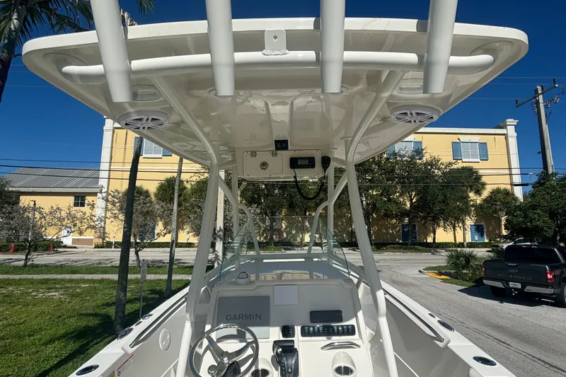 Slide: The Image of 2023 Sailfish 220 CC boat console with T-top and Garmin electronics. - 6