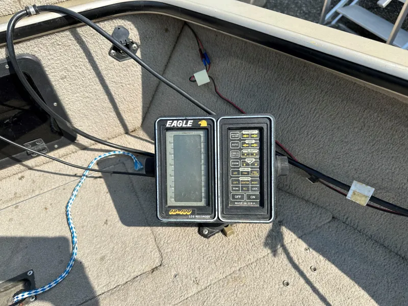 Slide: The Image of Eagle fish finder on 1994 Lund 1850 Tyee boat dashboard. - 6