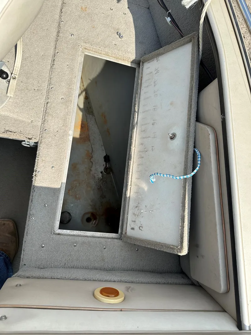 Slide: The Image of Open storage compartment in 1994 Lund 1850 Tyee boat interior. - 9