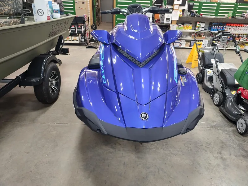 Slide: The Image of 2024 Yamaha WaveRunner GP SVHO in showroom, vibrant blue color, front view. - 1