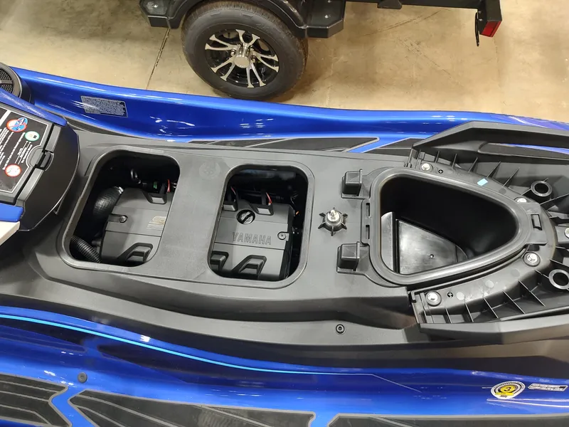 Slide: The Image of 2024 Yamaha WaveRunner GP SVHO storage compartments, blue exterior, detailed view. - 10