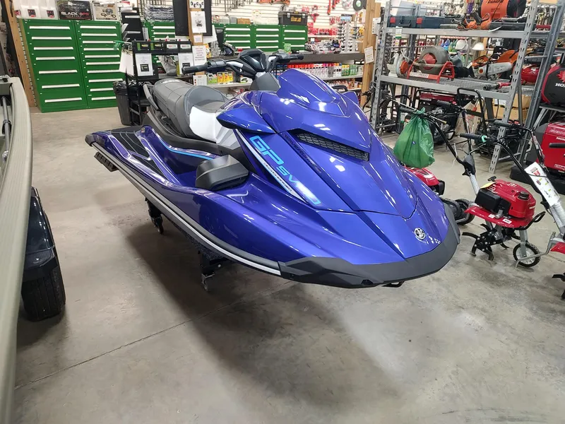 Slide: The Image of 2024 Yamaha WaveRunner GP SVHO in showroom, blue color, sleek design, displayed indoors. - 2