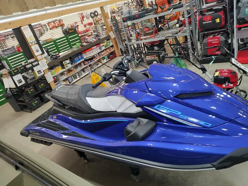Slide: The Image of 2024 Yamaha WaveRunner GP SVHO in a showroom, blue color, surrounded by tools and equipment. - 3