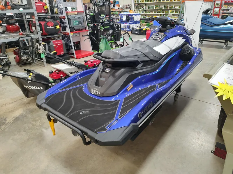 Slide: The Image of 2024 Yamaha WaveRunner GP SVHO in showroom, blue and black design, rear view. - 4