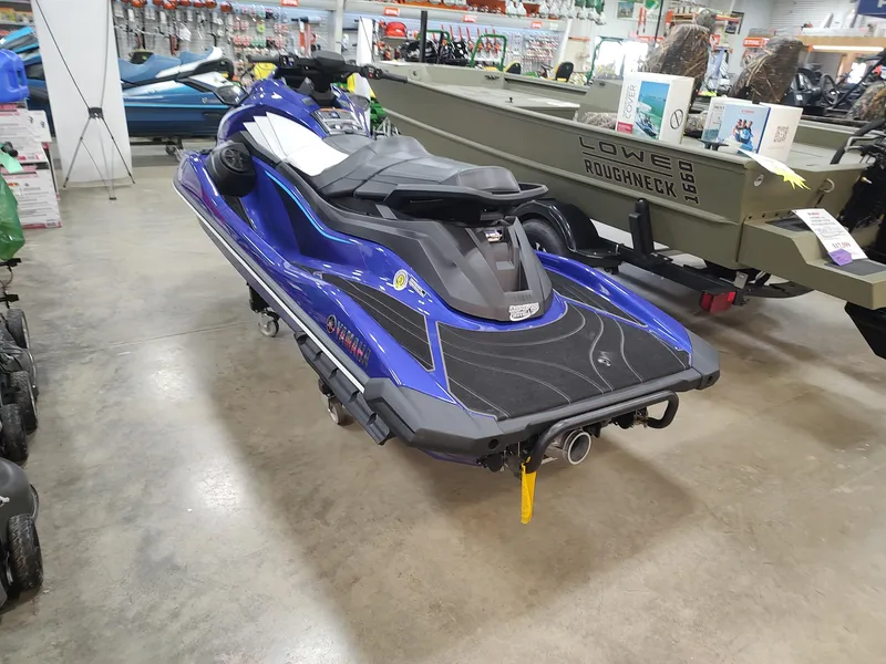 Slide: The Image of 2024 Yamaha WaveRunner GP SVHO in showroom, blue and black design, side view. - 6