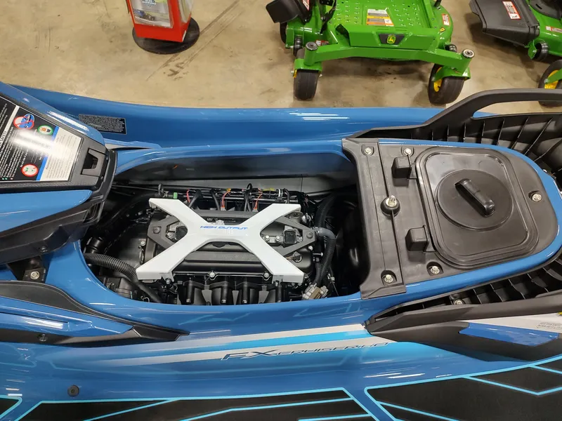 Slide: The Image of 2024 Yamaha WaveRunner FX Cruiser HO engine compartment, blue exterior, indoor display. - 10