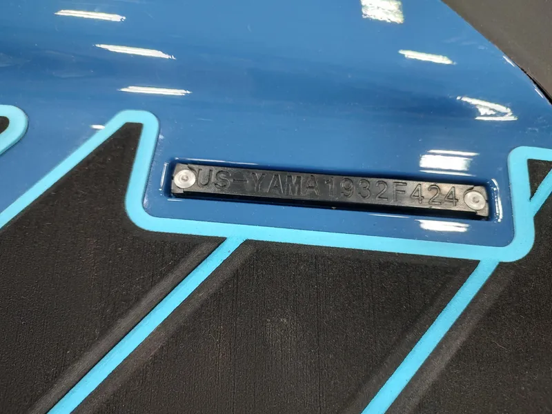 Slide: The Image of 2024 Yamaha WaveRunner FX Cruiser HO, blue and black design with identification plate. - 14