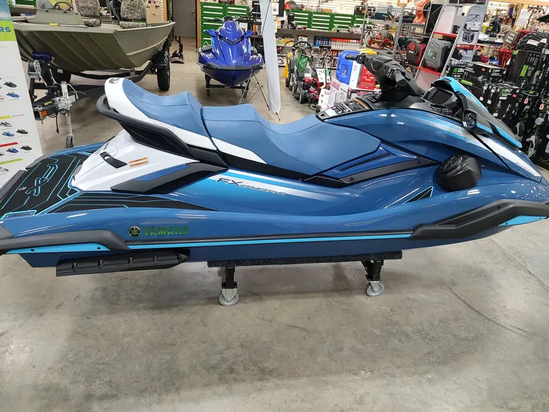 Slide: The Image of 2024 Yamaha WaveRunner FX Cruiser HO in showroom, blue color, side view. - 3