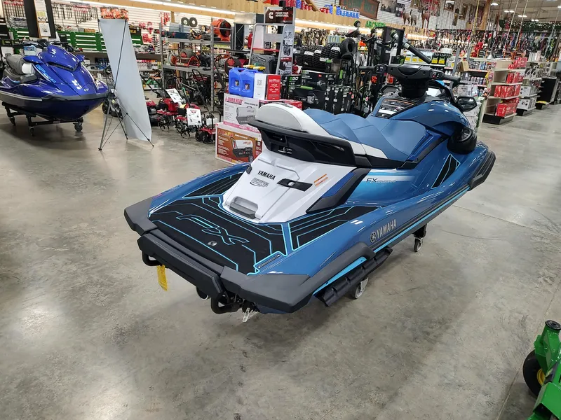 Slide: The Image of 2024 Yamaha WaveRunner FX Cruiser HO in showroom, blue and white design. - 4