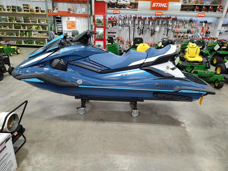 Slide: The Image of 2024 Yamaha WaveRunner FX Cruiser HO in showroom, blue color, side view. - 7