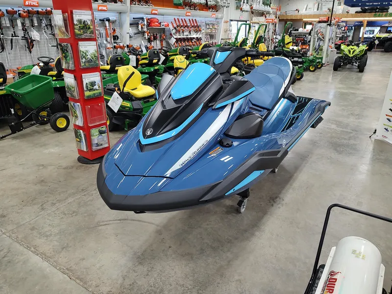Slide: The Image of 2024 Yamaha WaveRunner FX Cruiser HO in showroom, surrounded by various equipment. - 8