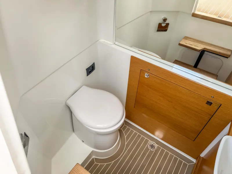 Slide: The Image of 2024 De Antonio Yachts D28 Open bathroom with modern design and wooden accents. - 11