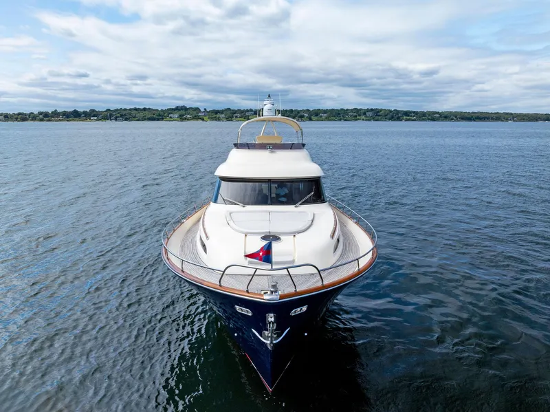 Slide: The Image of 2008 Mochi Craft Dolphin yacht on open water, front view. - 10
