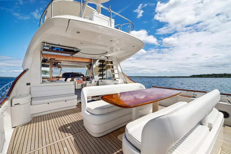 Slide: The Image of Luxurious 2008 Mochi Craft Dolphin yacht with elegant seating and ocean view. - 16