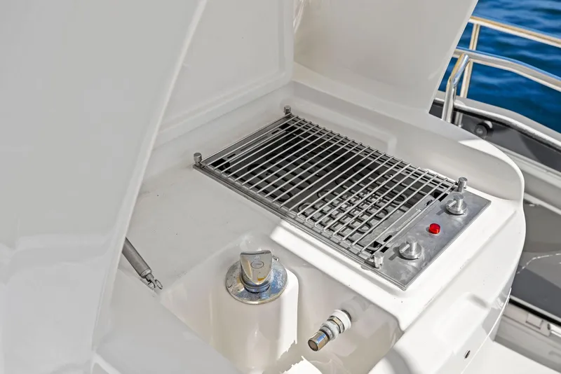Slide: The Image of Outdoor grill on 2008 Mochi Craft Dolphin yacht, featuring stainless steel design. - 30