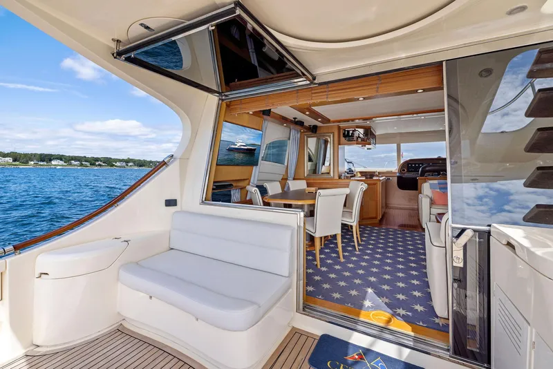 Slide: The Image of Luxurious 2008 Mochi Craft Dolphin yacht interior with elegant seating and ocean view. - 31