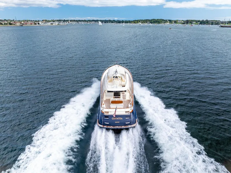 Slide: The Image of 2008 Mochi Craft Dolphin yacht cruising on open water. - 4