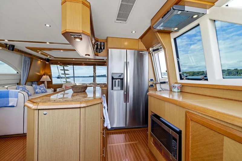Slide: The Image of Luxurious 2008 Mochi Craft Dolphin yacht interior with modern kitchen and scenic windows. - 40