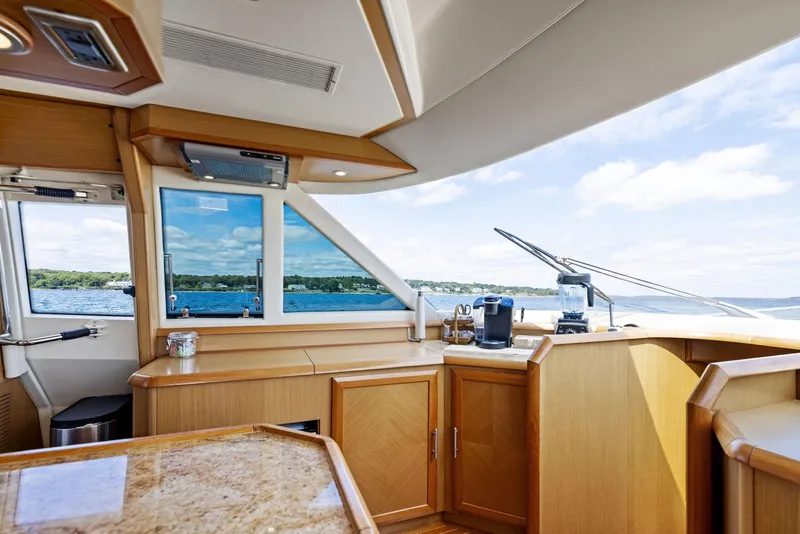 Slide: The Image of Interior of 2008 Mochi Craft Dolphin yacht with wooden cabinetry and ocean view. - 41