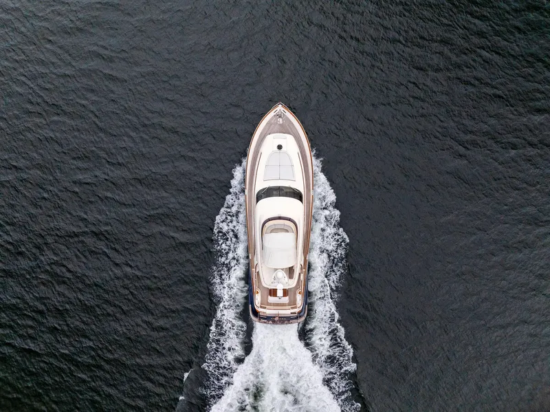 Slide: The Image of Aerial view of 2008 Mochi Craft Dolphin yacht cruising on open water. - 7