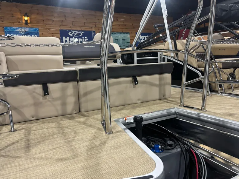 Slide: The Image of 2025 Harris CRUISER 230 SL interior with beige seating and open storage compartment. - 8