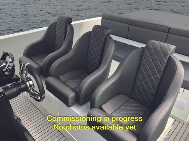 Slide: The Image of De Antonio Yachts D28 Xplorer 2024 interior with luxurious seating, commissioning in progress. - 3