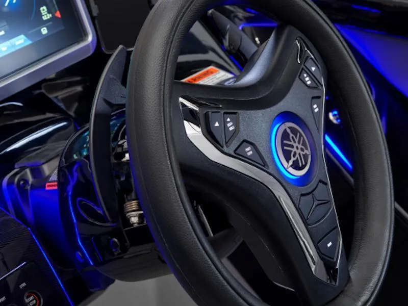 Slide: The Image of Steering wheel of 2024 Yamaha Boats 255XD with illuminated controls and modern design. - 4