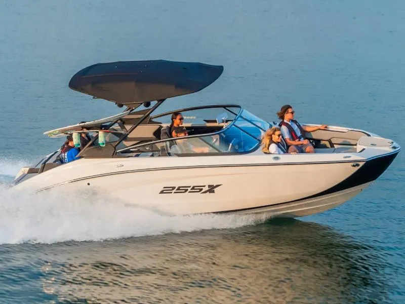 Slide: The Image of 2024 Yamaha Boats 255XD cruising on water with passengers. - 5