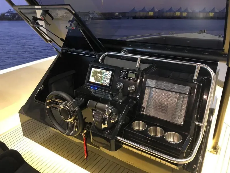 Slide: The Image of 2024 De Antonio Yachts D28 Xplorer cockpit with modern navigation system and controls. - 4