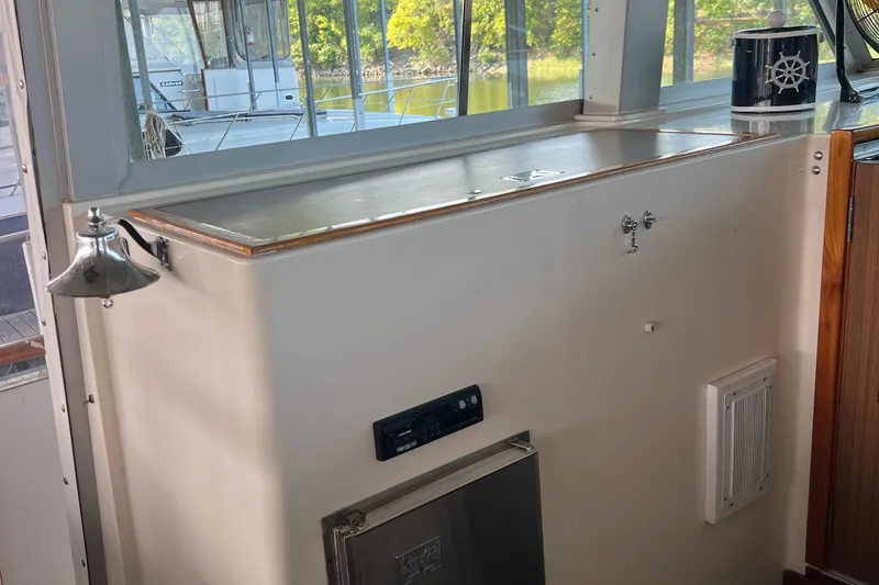 Slide: The Image of Interior of a 1977 Bertram 42 Motor Yacht with nautical decor. - 13