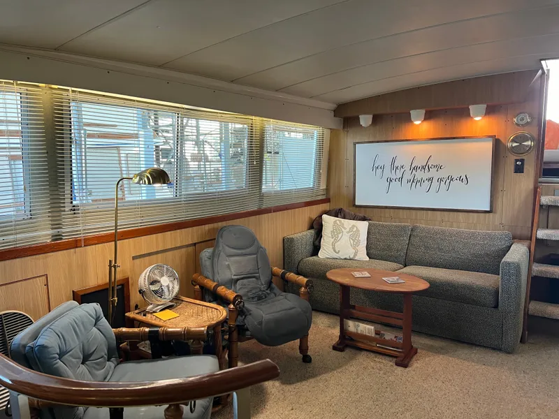 Slide: The Image of Cozy interior of 1977 Bertram 42 Motor Yacht with seating and decor. - 15