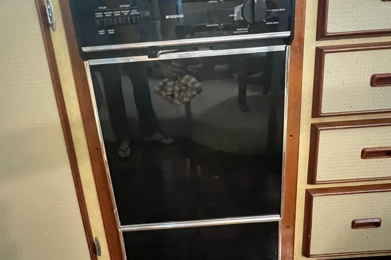 Slide: The Image of 1977 Bertram 42 Motor Yacht interior oven and cabinetry detail. - 22