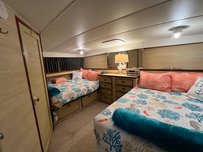 Slide: The Image of Cozy 1977 Bertram 42 Motor Yacht cabin with twin beds and nautical decor. - 23