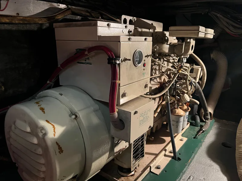 Slide: The Image of Engine room of a 1977 Bertram 42 Motor Yacht, showcasing machinery and components. - 35