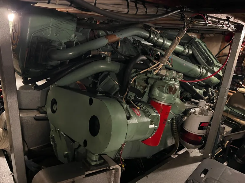 Slide: The Image of Engine room of a 1977 Bertram 42 Motor Yacht, showcasing mechanical components. - 37