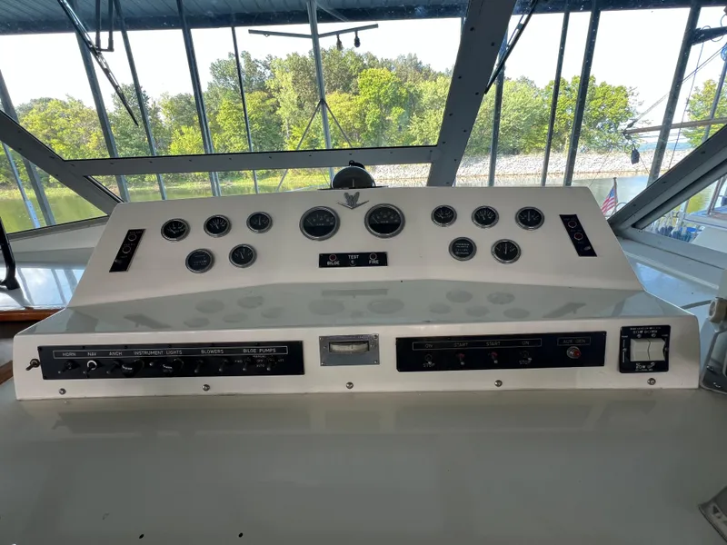 Slide: The Image of Control panel of a 1977 Bertram 42 Motor Yacht with gauges and switches. - 5
