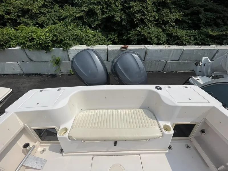 Slide: The Image of 2003 Grady-White 232 Gulfstream boat interior with seating and twin outboard motors. - 10