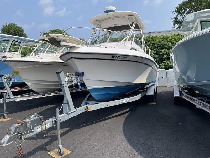 Slide: The Image of 2003 Grady-White 232 Gulfstream boat on trailer, parked outdoors. - 3