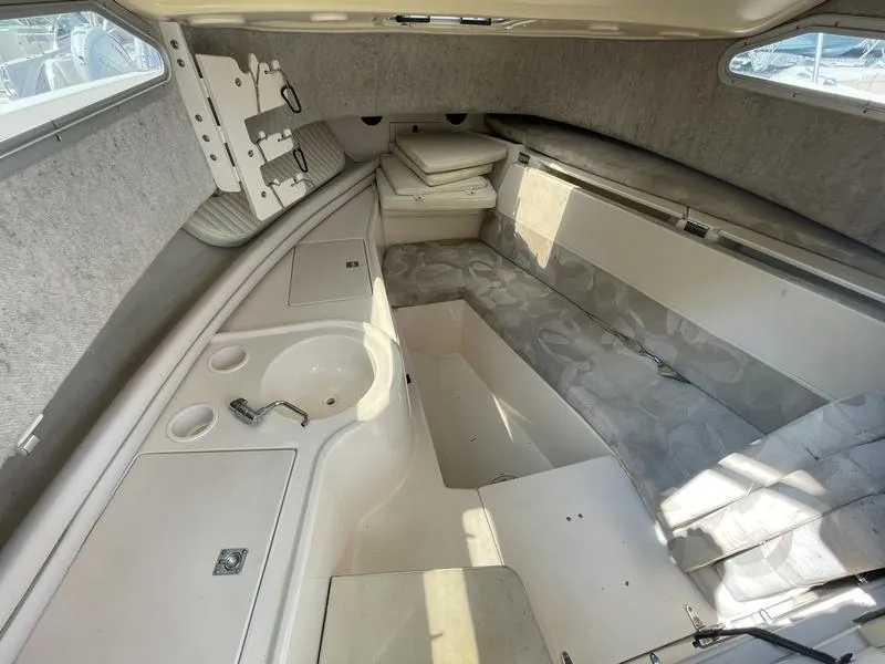 Slide: The Image of 2003 Grady-White 232 Gulfstream cabin interior with seating and sink. - 7