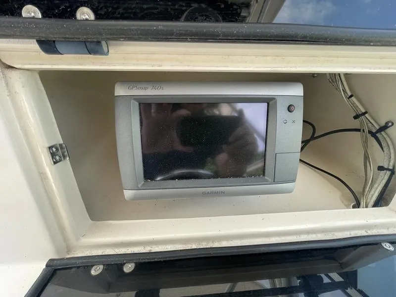 Slide: The Image of Garmin GPS device installed on 2003 Grady-White 232 Gulfstream boat dashboard. - 8