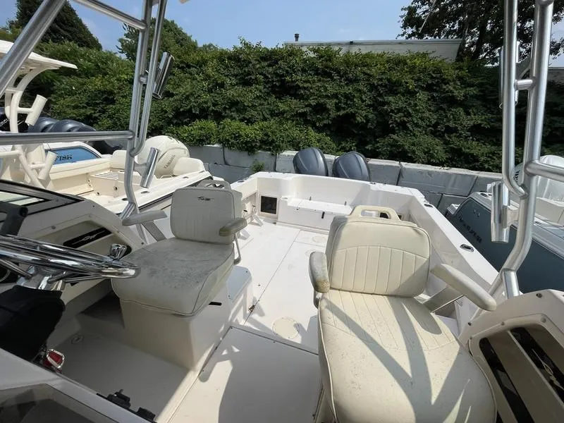 Slide: The Image of 2003 Grady-White 232 Gulfstream boat interior with seating and controls. - 9