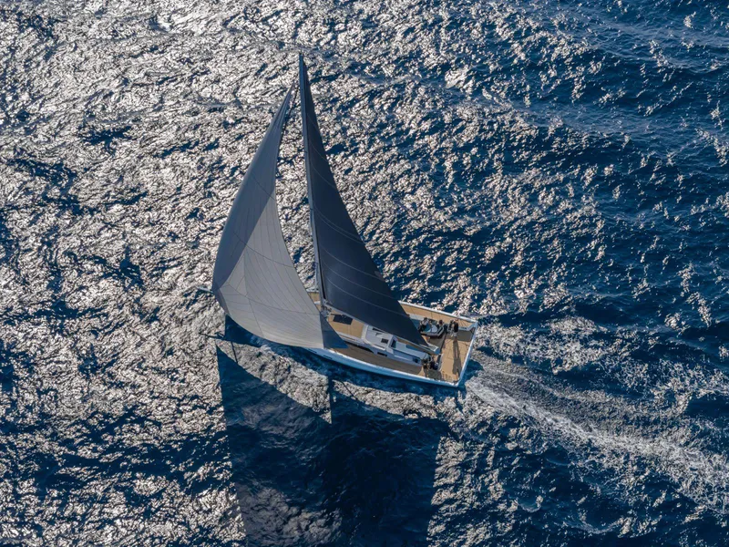 Slide: The Image of Grand Soleil 52 Performance 2025 sailing on open ocean, aerial view. - 15