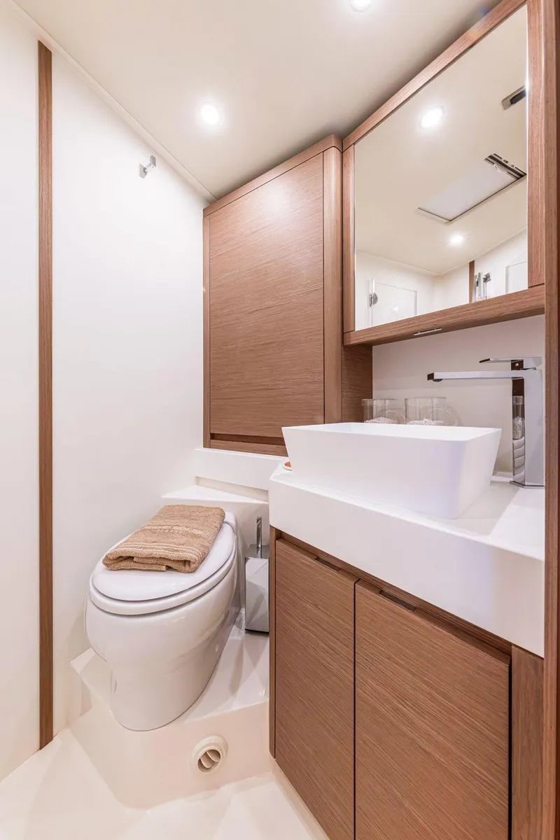 Slide: The Image of Luxurious bathroom in 2025 Grand Soleil 52 Performance yacht with modern fixtures and wood accents. - 21