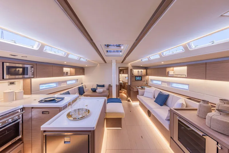 Slide: The Image of Luxurious interior of 2025 Grand Soleil 52 Performance yacht, featuring modern kitchen and seating area. - 23