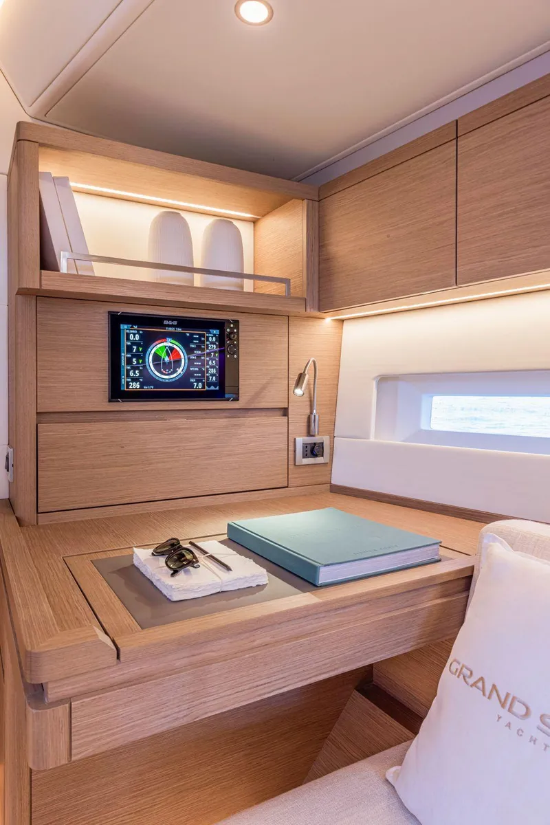 Slide: The Image of Luxurious interior of 2025 Grand Soleil 52 Performance yacht with modern wood finish. - 25