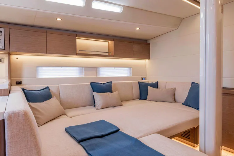 Slide: The Image of Luxurious interior of 2025 Grand Soleil 52 Performance yacht with beige and blue decor. - 31